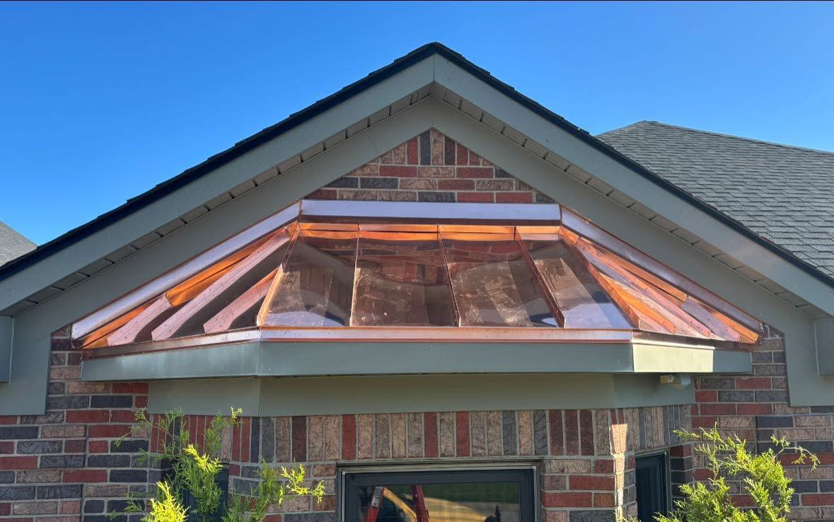 Copper awning roofing detail installed by Fortress Roofing LLC