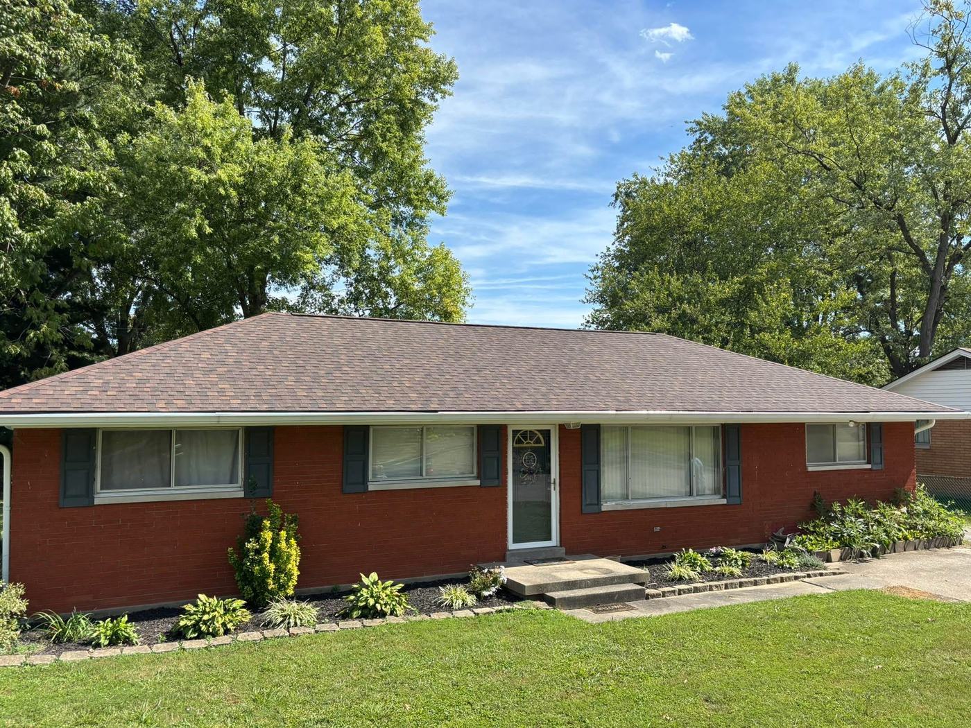 Completed roof replacement on brick home