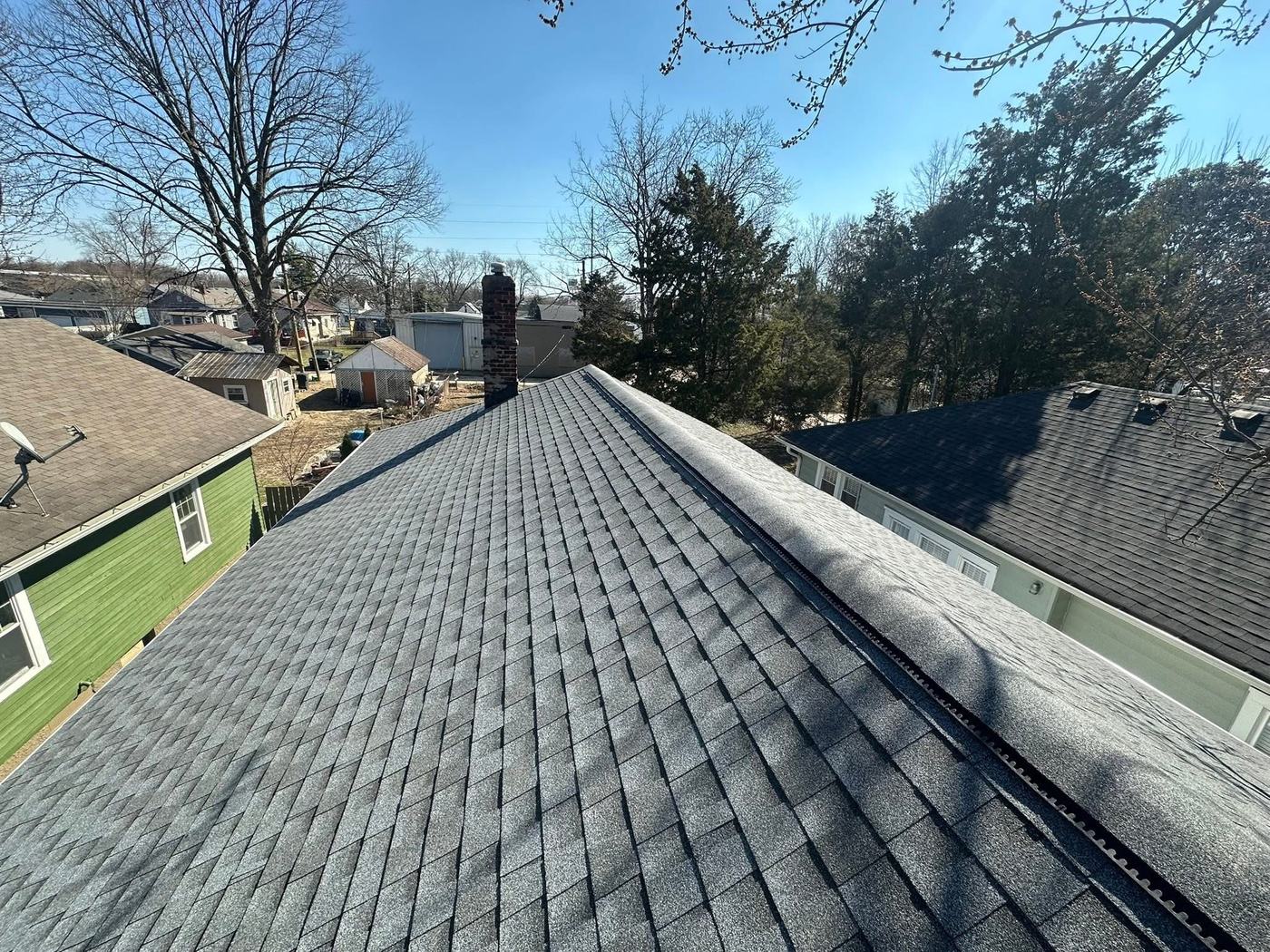 Finished gray shingle roof on residential property