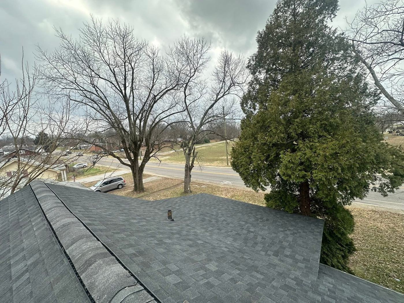 Finished residential roofing project photographed from above